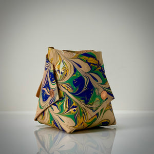 Load image into Gallery viewer, ROCWORX Marbled leather Origami inspired vessel, Abstract pattern in dark green, blue, yellow gold, finished with copper rivets