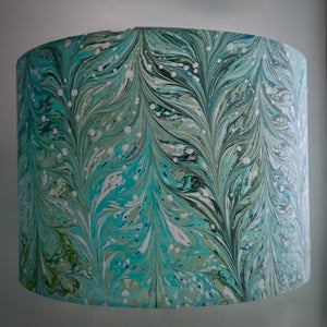 Load image into Gallery viewer, Organic cotton 30cm drum lampshade with feathered chevron marbling pattern in teal and dark green with antique white