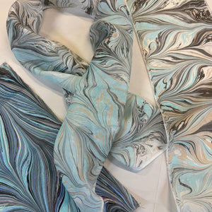 Load image into Gallery viewer, Marbled fabric with blue and gray patterns on a white background