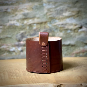 Load image into Gallery viewer, Leather storage pot, in small.  Use as a plant pot, or for pen pot in the home office.  Oak bark veg-tanned leather in Dark London Tan.  Hand-stitched base using traditional saddle stitch for strength and loop attached with a ladder stitch and copper rivet.