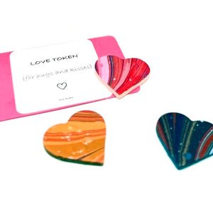 Load image into Gallery viewer, Marbling paper on repurposed leather hearts with sign saying love token for hug or kiss. 
