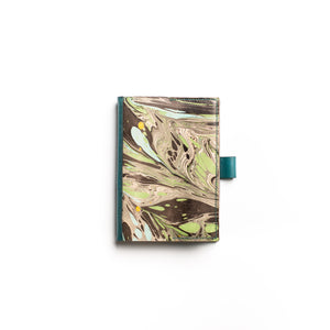 Load image into Gallery viewer, A6 veg-tanned marbled leather journal in Abstract Feathers pattern in Monochrome, Teal and Green. Hand-stitched in teal linen thread in traditional saddle stitch on Dark Teal veg-tanned leather.  Pen holder. 
