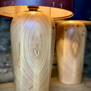 Load image into Gallery viewer, Detail of PJW Woodworks Ash wooden lamp base, with base of RUGGLESTONE leather lampshade

