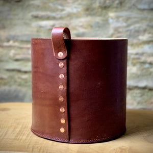 Load image into Gallery viewer, Leather storage bin.  Oak bark veg-tanned leather in Dark London Tan.  Hand-stitched base using traditional saddle stitch for strength.  Loop attached with copper rivets.
