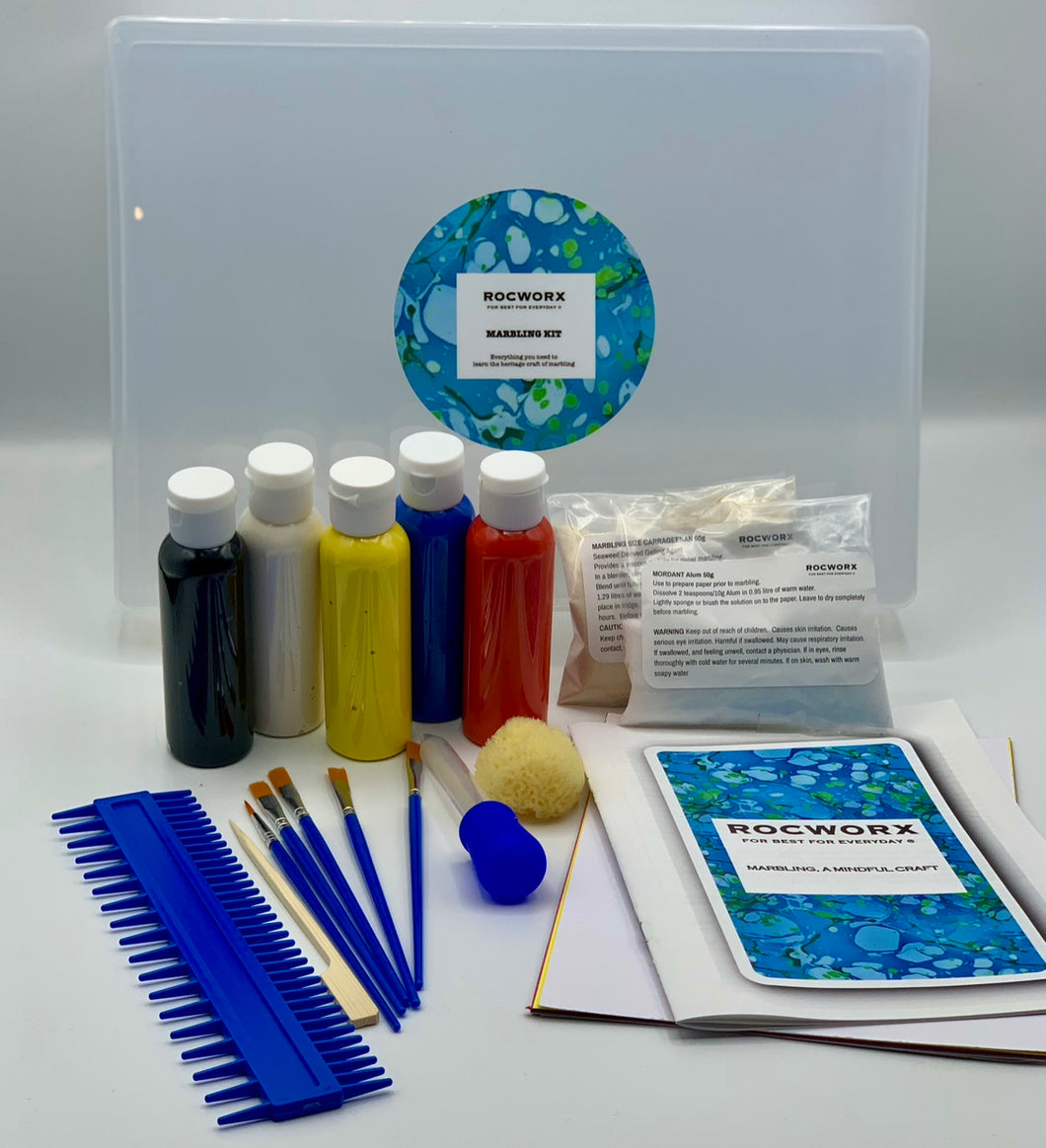 Marbling Kit containing everything you need to marble successfully at home. Comes in an A4 plastic lidded bath tray, acrylic paints, brushes, stylus, Combe, pipette, pipette brush cleaner, marbling mix, mordant mix, natural sponge, papers, card, and guide.
