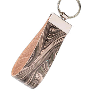 Load image into Gallery viewer, Marbled veg-tanned leather key fob, abstract monochrome pattern. On silver key ring

