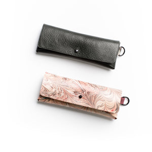 Load image into Gallery viewer, ROCWORX Marbled veg-tanned leather in Feathers pattern. Colours of Dark Cherry Red, Maroon, Black and Peach.  Finished with a simple button and leather loop D-ring.  Shown here with supple Italian veg-tanned leather case in Dark Green

