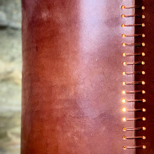Load image into Gallery viewer, ROCWORX.  Detail of the RUGGLESTONE Leather Lampshade in Dark London Tan.  Ladder stitched in waxed linen thread and repurposed electrical copper wire.

